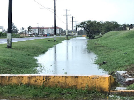 Blocked drainage ditch alongside the road in Garapan, Saipan